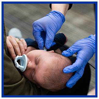 Audiology student working with a pediatric standardized patient